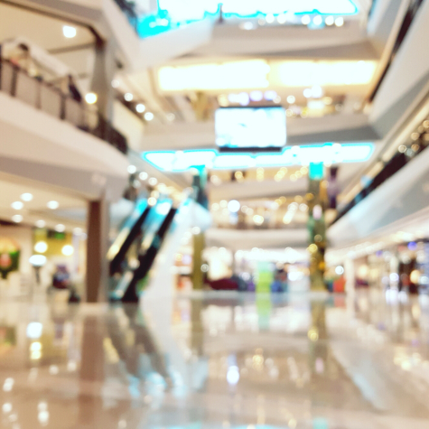 Blurred image of shopping centre - AWH provide expert valuations of all classes of commercial property