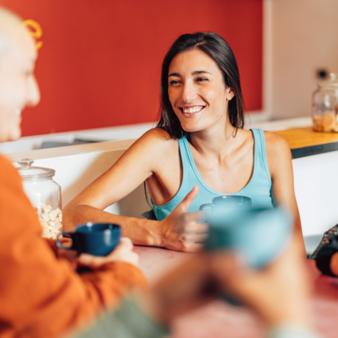 Friends In A Co-living Space Relaxing With A Cup Of Coffee - The Rise of Co-Living