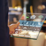 Close-up of a glass tablet that controls all the functions of the building