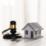 Judge Gavel, House Model And Keys on white background
